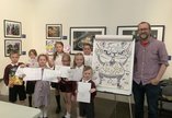 Group of schoolchildren with illustrator